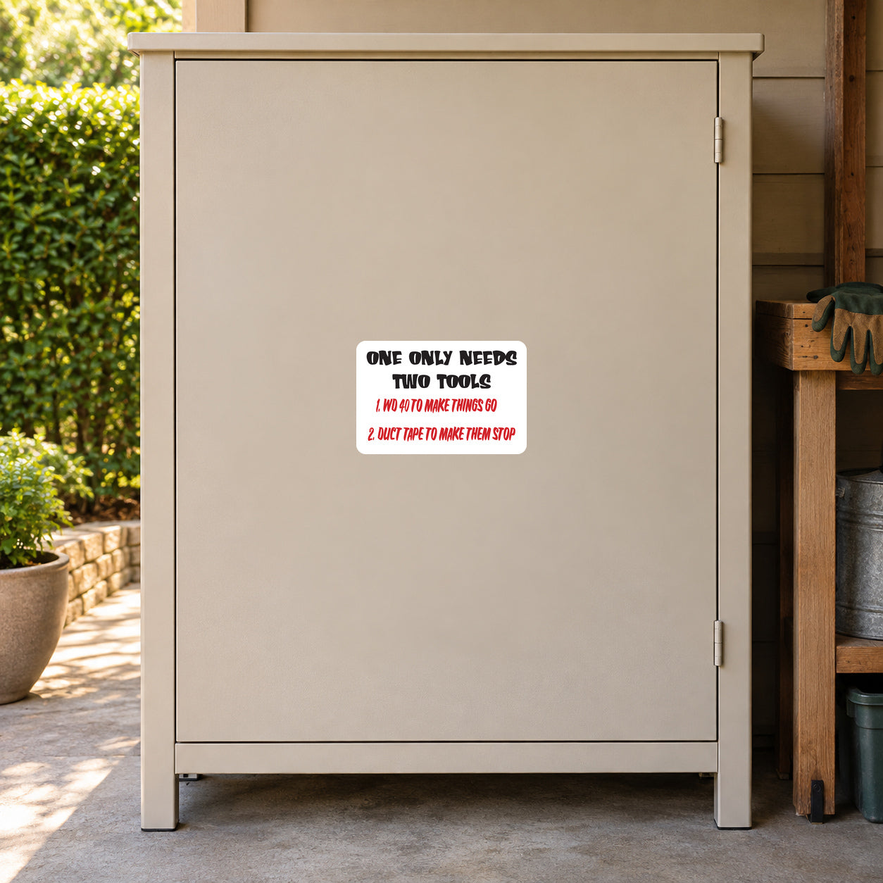 White tools sign sticker with black/red text: 'ONE ONLY NEEDS TWO TOOLS'