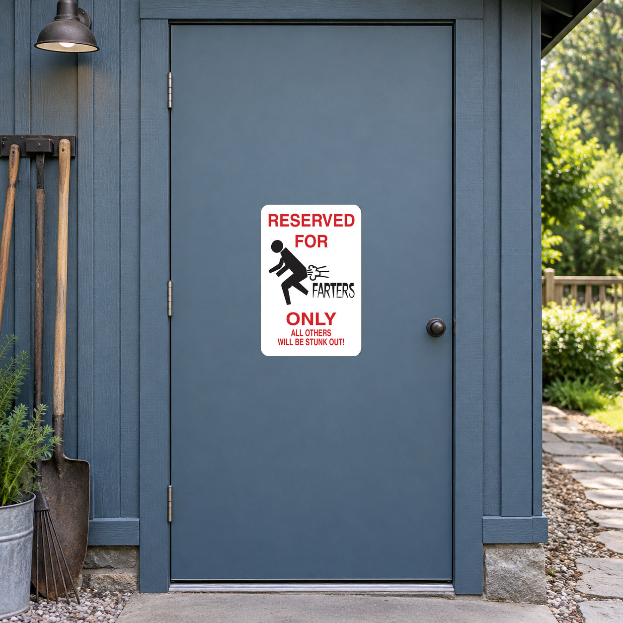 Reserved For Farters Fun Sign Sticker applied to a slate blue rural workshop door