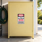 Man Room Fun Sign Sticker applied to a pale yellow private garage cabinet