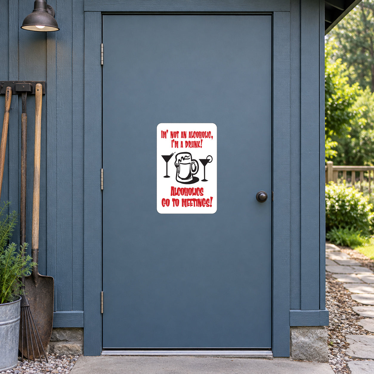 I'm Not An Alcoholic, I'm A Drunk Fun Sign Sticker applied to a slate blue rural workshop door