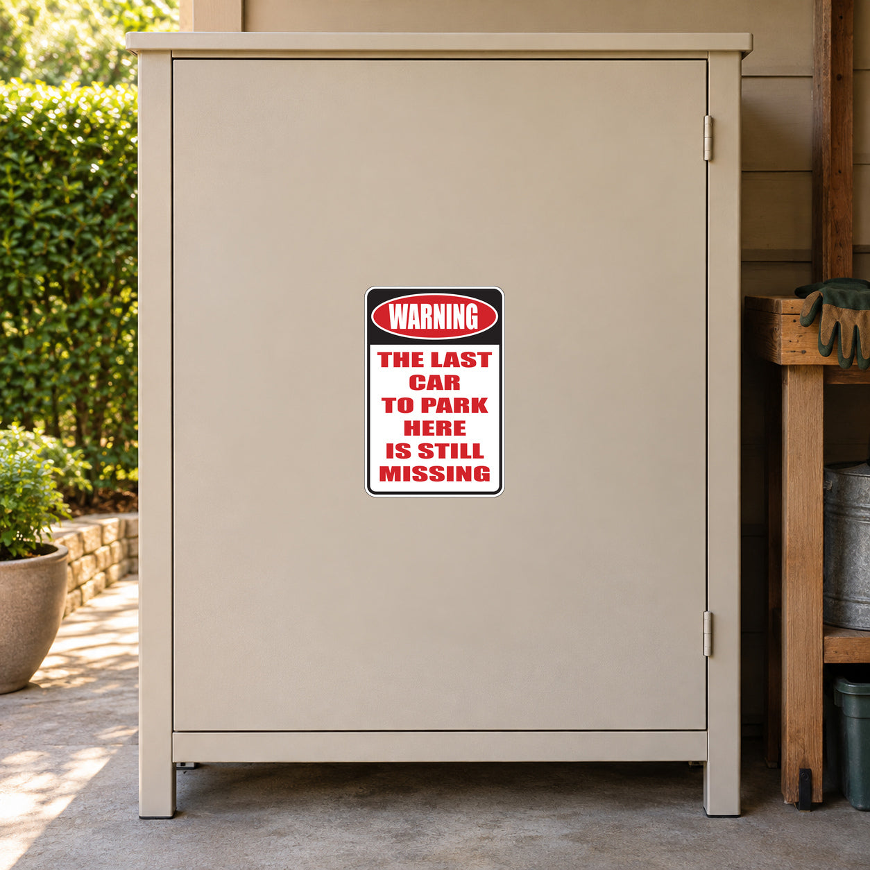 The Last Car To Park Here Is Still Missing Fun Sign Sticker applied to a beige private driveway workshop cabinet