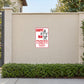 Carpet Man Parking Only Sticker applied to a beige garden boundary wall