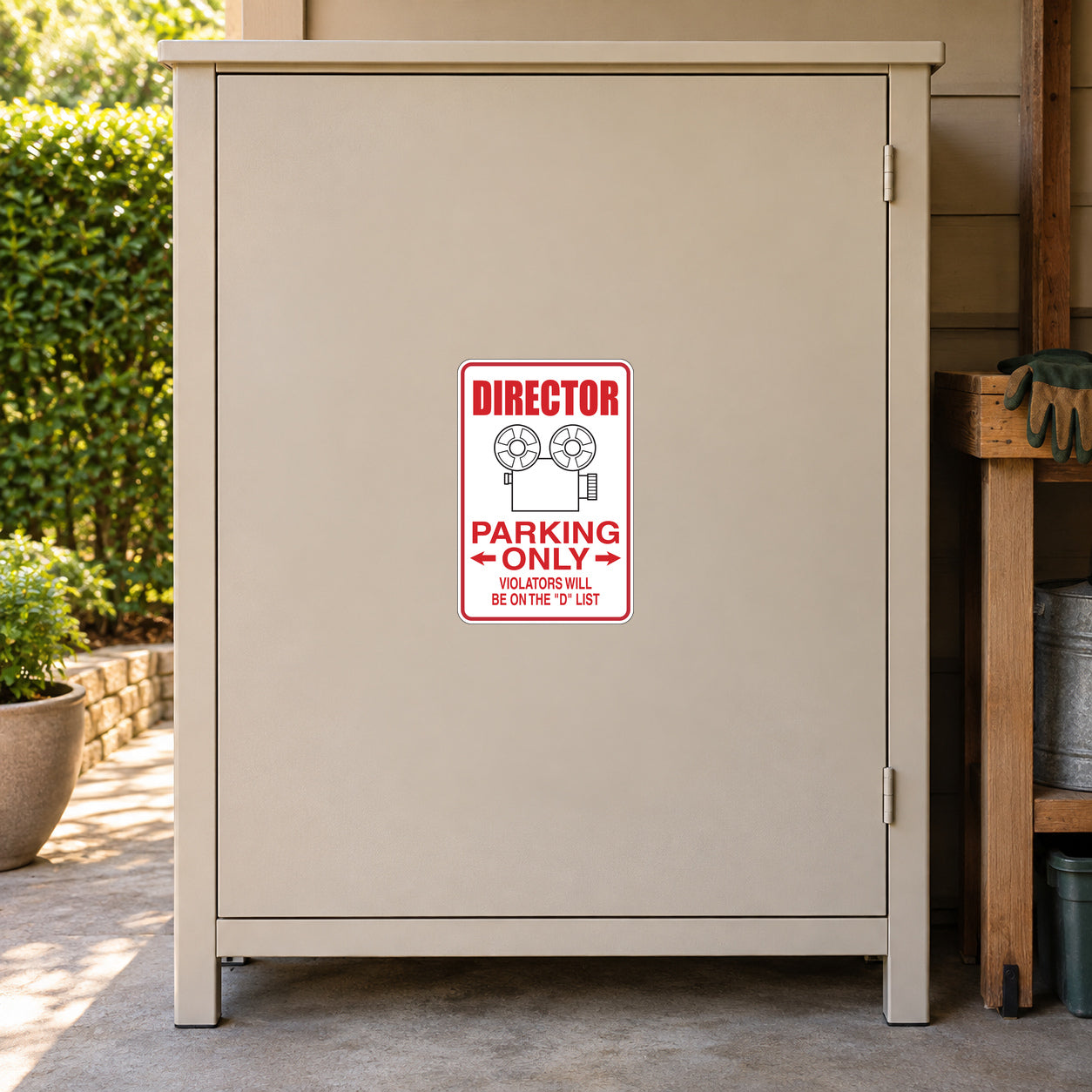 Director Parking Only Sticker applied to a beige private driveway workshop cabinet