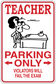Teacher parking only parking sticker with teacher at desk and 'Violators will fail the exam'