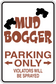 Fun sign sticker reading 'MUD BOGGER' and 'PARKING ONLY' with arrows; 'VIOLATORS WILL BE SPRAYED'.