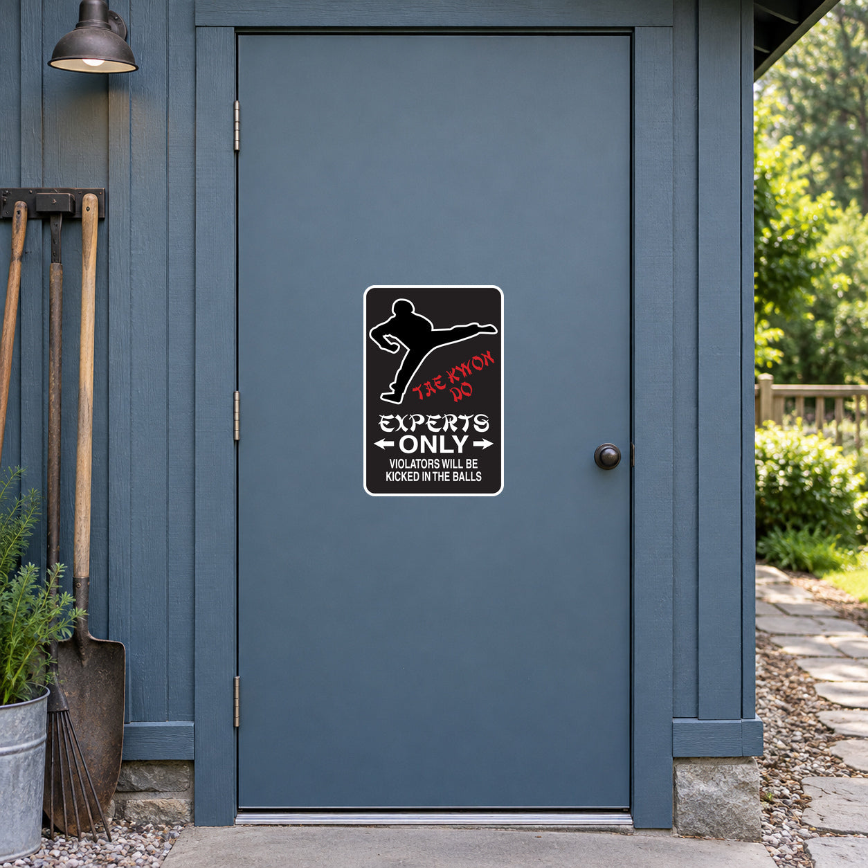 Fun Sign Sticker applied to a slate blue rural workshop door