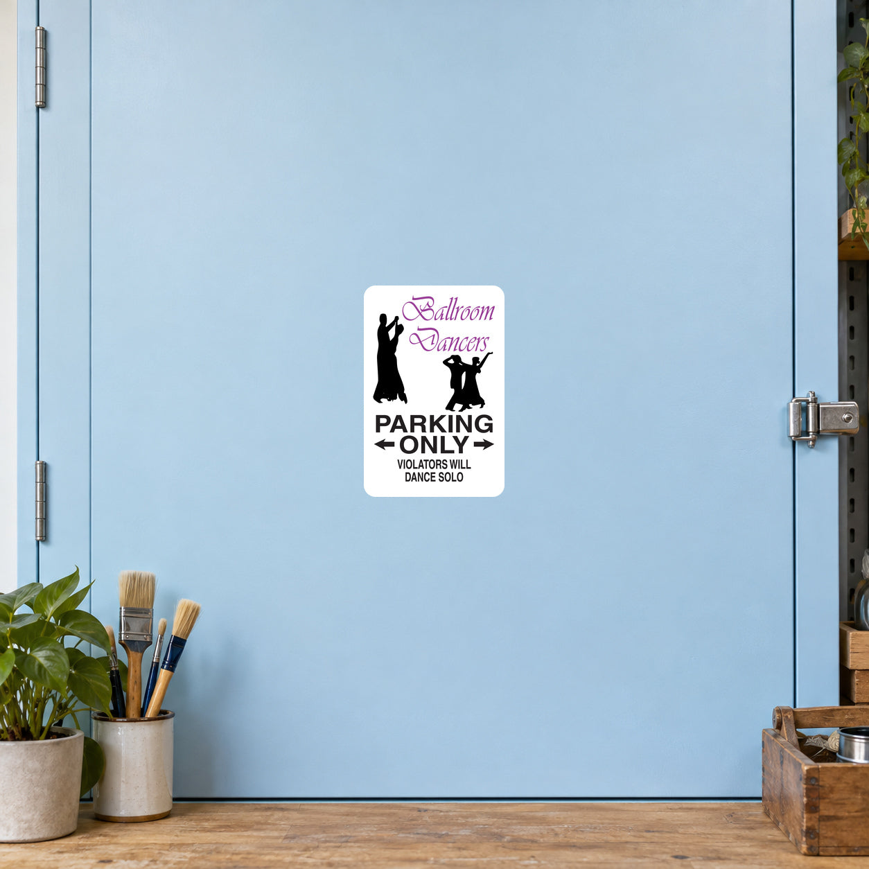 White rectangular sticker: purple dancer graphic, bold 'PARKING ONLY' text.
