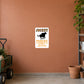 Fun Sign Sticker applied to a terracotta private lane maintenance wall