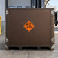 Hazard warning sticker with orange diamond and black 1.2D radiation symbol