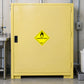 Hazardous Safety Sign Sticker applied in an oxidizing chemical storage room, smooth pale yellow safety cabinet front, laboratory utility fixtures only at outside edges