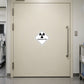 Hazardous sign sticker with radioactive symbol and RADIOACTIVE text on a door