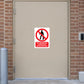 NO Safety Sign Sticker applied in a private distribution-center operations room entrance, smooth pale tan solid door, brick surround and access reader at outer edges