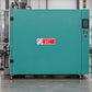 NO Safety Sign Sticker applied in industrial packaging machine cabinet, single solid teal casing panel, control console extreme right