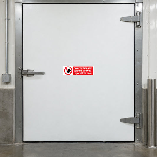 NO Safety Sign Sticker applied in restricted cold-storage service entrance, smooth solid white insulated door, hardware and steel surround at outer edges