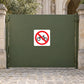 White safety sign sticker with red no-bicycle symbol on dark surface