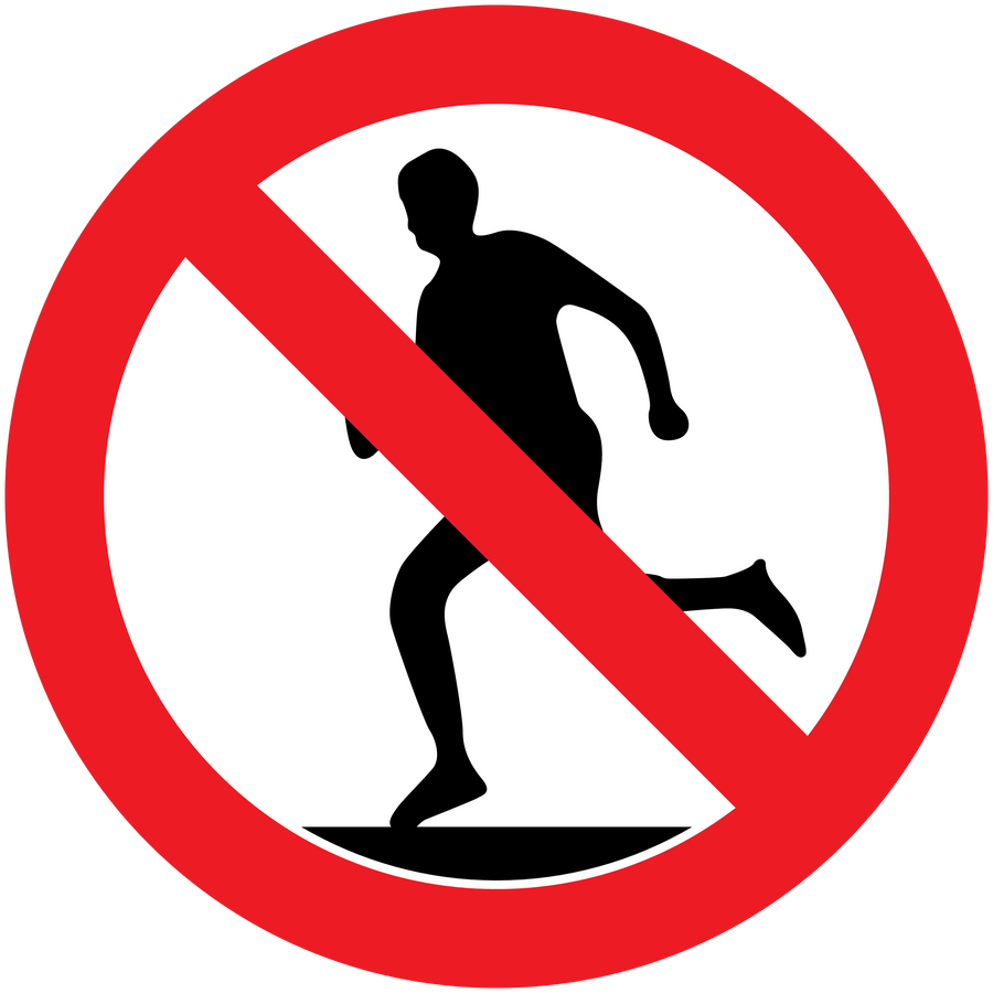 Safety sign sticker with red no-walking symbol and barred silhouette