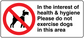 Warning sign sticker: red no-dog symbol and 'Please do not exercise dogs in this area'