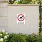 White sticker with red no-dog symbol and NO FOULING text
