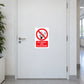 NO Smoking Sign Sticker applied in single white clinic corridor door with handle far left