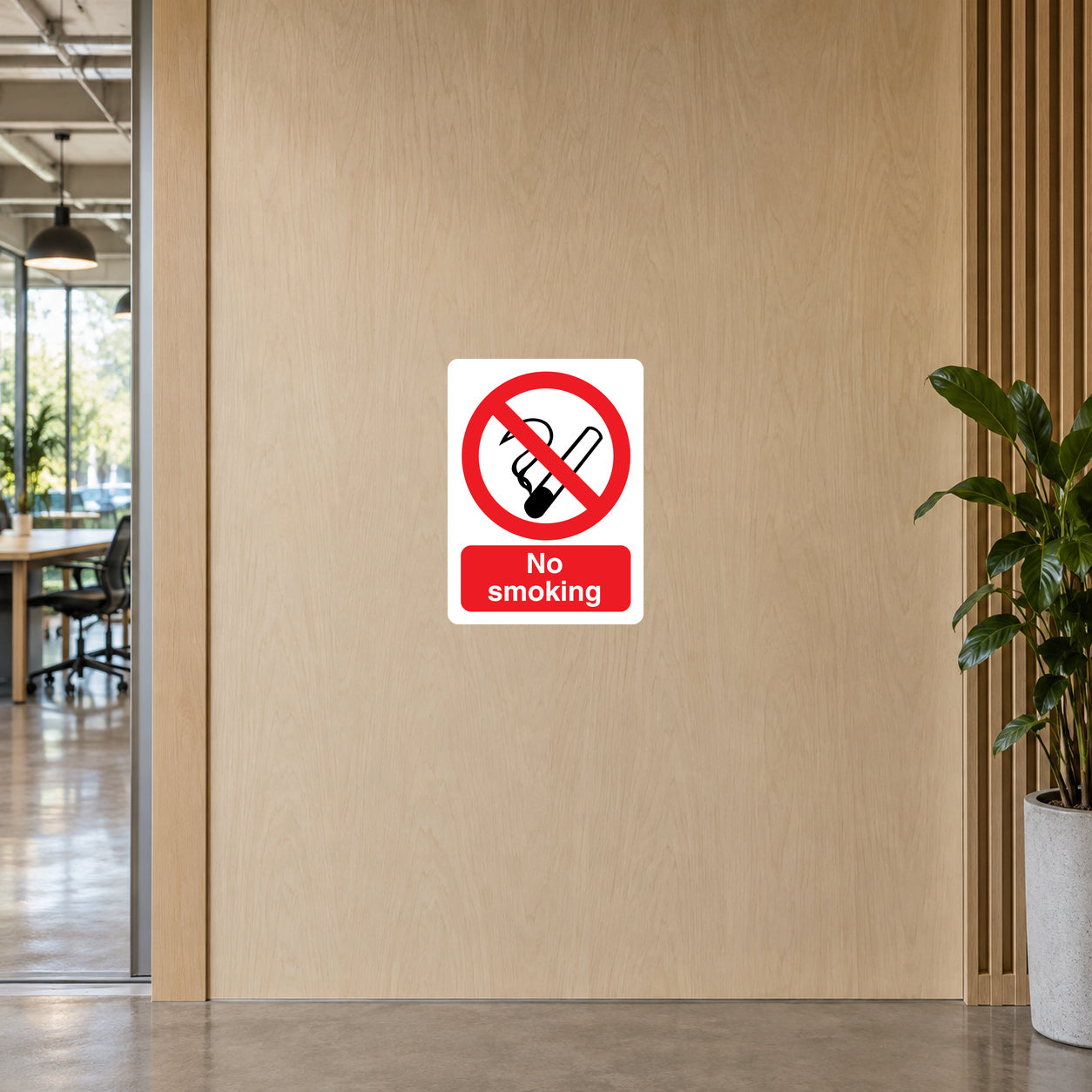NO Smoking Sign Sticker applied in pale oak veneer coworking entrance wall, plant at edge