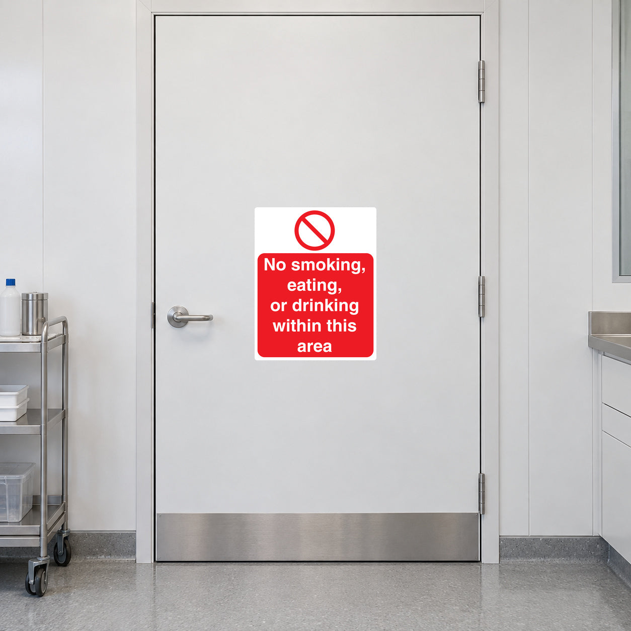 NO Smoking Sign Sticker applied in white smooth laboratory entry door, stainless trolley at far left