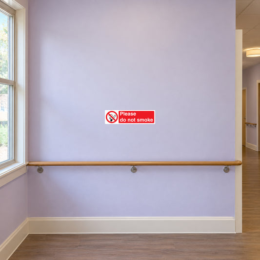 NO Smoking Sign Sticker applied in pale lavender smooth retirement home corridor wall, framed window at extreme edge