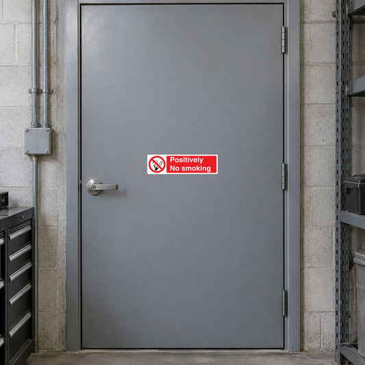 NO Smoking Sign Sticker applied in single grey industrial storeroom door, closed machinery at edges