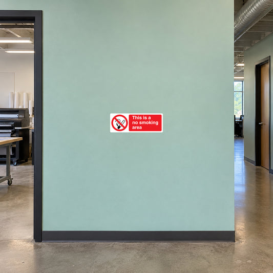 NO Smoking Sign Sticker applied in smooth seafoam staff hallway wall at a printing company