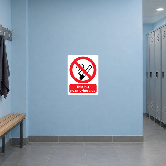 NO Smoking Sign Sticker applied in pale blue sports center changing corridor wall, bench extreme left