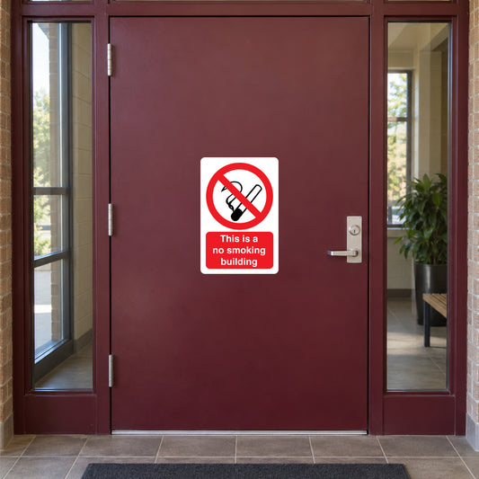 NO Smoking Sign Sticker applied in solid burgundy community hall entrance door with tiled vestibule