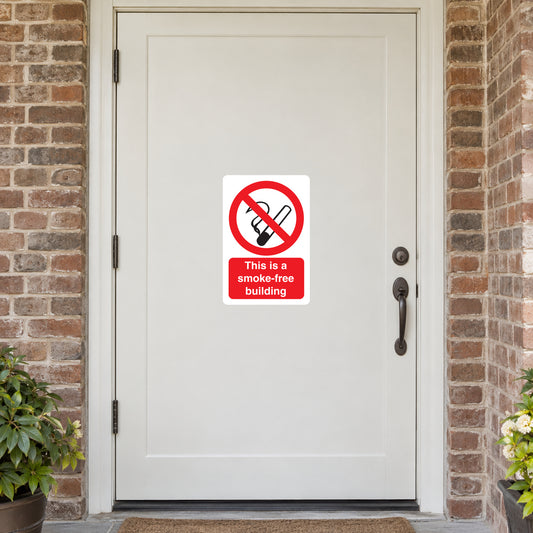 NO Smoking Sign Sticker applied in solid ivory community center entrance door with brick jambs