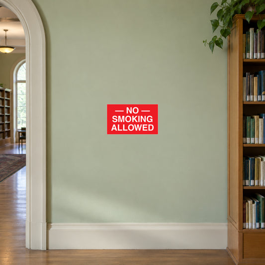 NO Smoking Sign Sticker applied in pale green library corridor wall beside bookcase edge