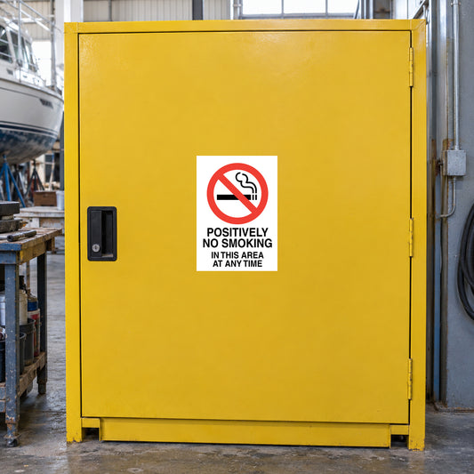 NO Smoking Sign Sticker applied in solid yellow solvents cabinet door in a boat repair workshop