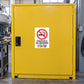 NO Smoking Sign Sticker applied in solid yellow solvents cabinet door in a boat repair workshop