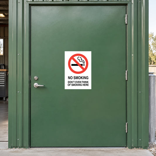 NO Smoking Sign Sticker applied in single green workshop equipment storage door