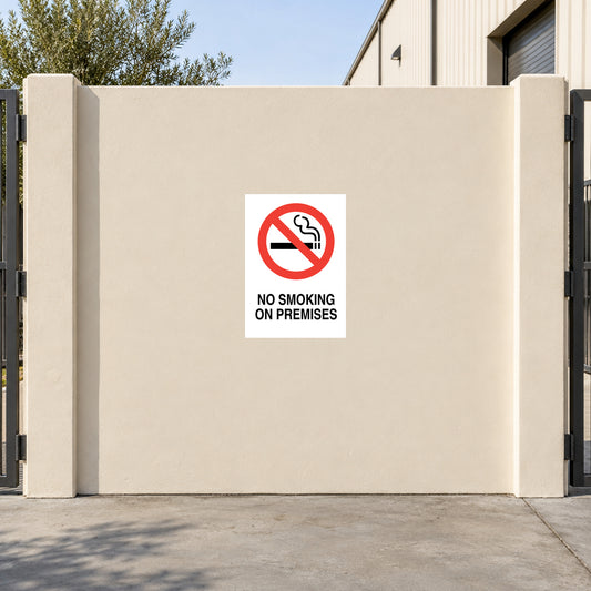 NO Smoking Sign Sticker applied in flat cream courtyard gate outside a warehouse