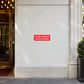 No smoking sign sticker with red "Please extinguish before entering" text