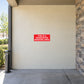 No smoking sign sticker with red background and white text: “designated smoking area”
