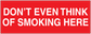No smoking sign sticker with white text: DON'T EVEN THINK OF SMOKING HERE
