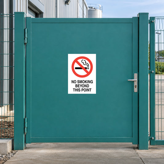NO Smoking Sign Sticker applied in solid teal gate separating factory pedestrian entrance and external smoking area