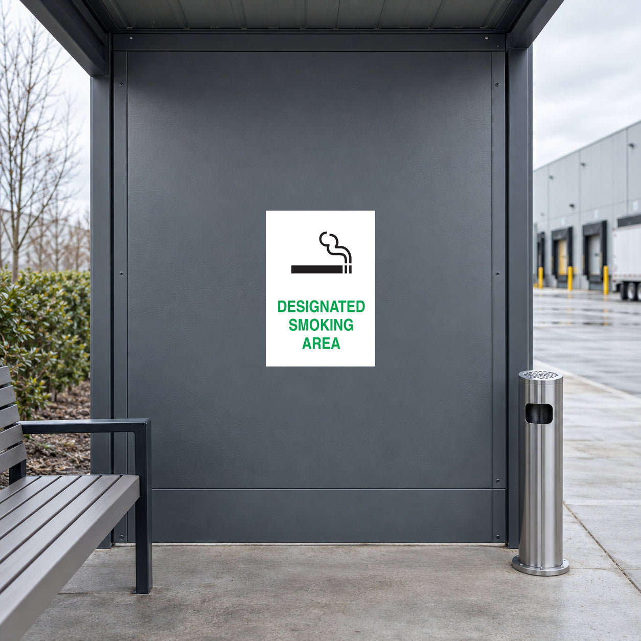 Designated Smoking Area sticker on an outdoor employee smoking shelter wall