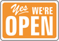 Orange business open sign sticker with white border and text “Yes We’re Open”