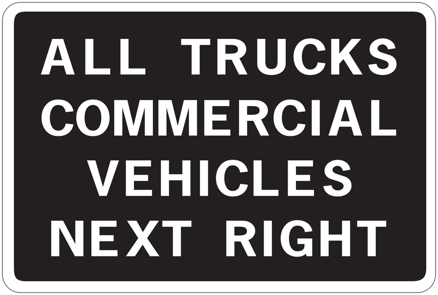 Road sign sticker with text "ALL TRUCKS COMMERCIAL VEHICLES NEXT RIGHT"