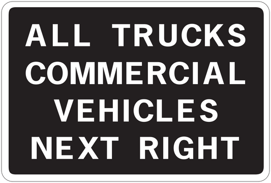 Road sign sticker with text "ALL TRUCKS COMMERCIAL VEHICLES NEXT RIGHT"