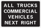 Road sign sticker with text "ALL TRUCKS COMMERCIAL VEHICLES NEXT RIGHT"