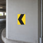 Square road sign sticker with yellow background and black left arrow