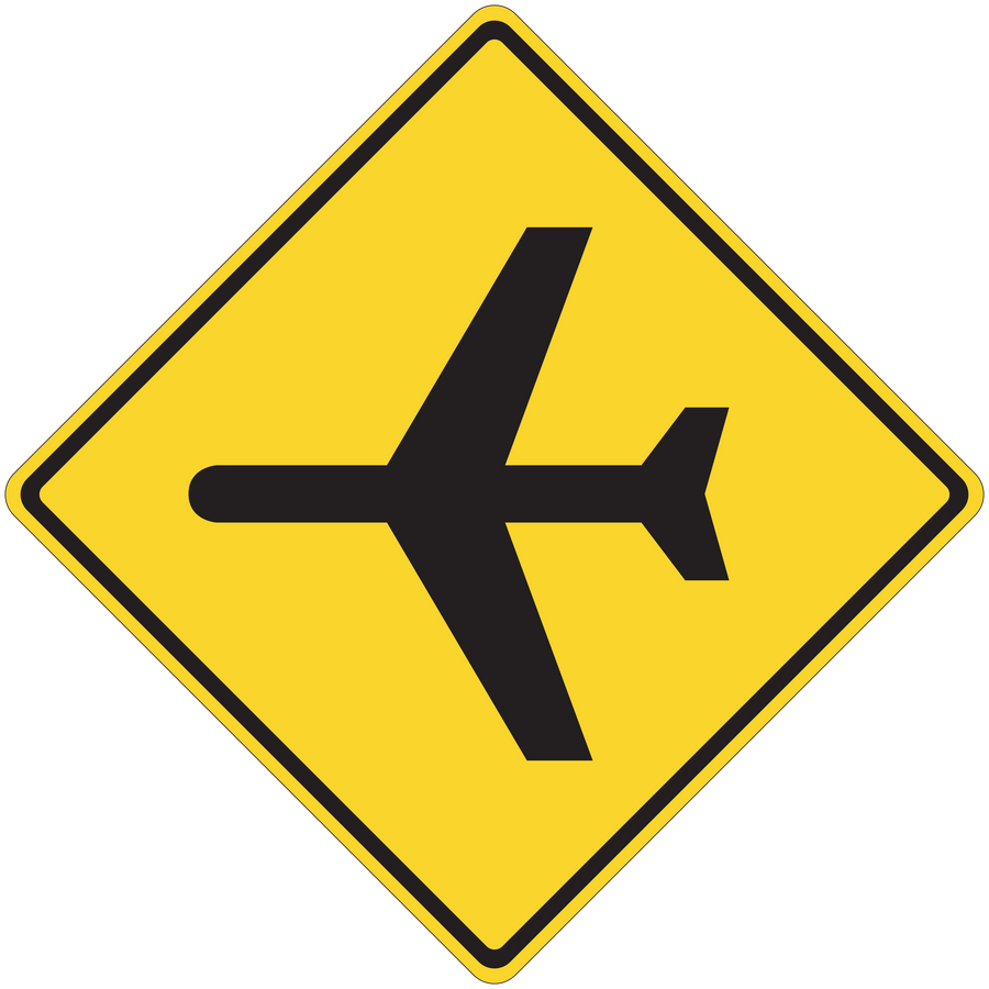 Road sign sticker: yellow diamond with black directional arrows.
