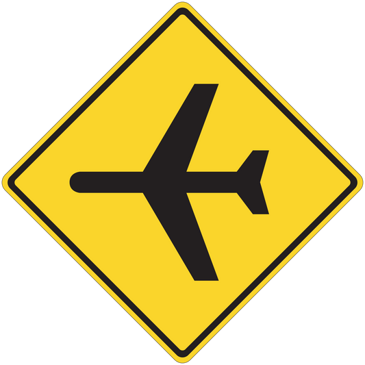 Road sign sticker: yellow diamond with black directional arrows.