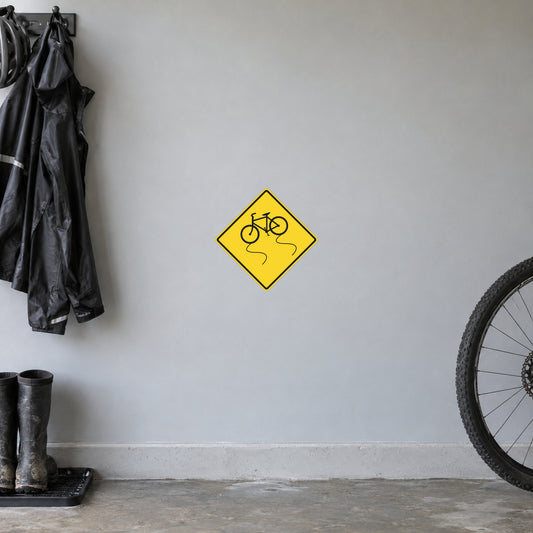 Yellow road sign sticker with bicycle icon inside a diamond