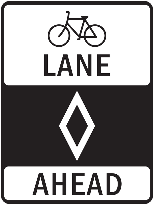 Road sign sticker with bicycle lane icons and text "LANE" and "AHEAD"